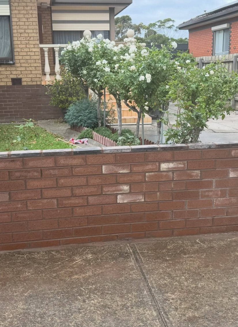 Red brown brick front fence with integrated letterbox pillar