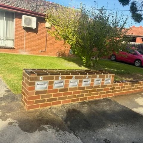 Multi brick mailbox wall with six integrated letterboxes