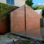 Red brick wall for pitched garage roof by Alternative Bricklaying Red brick wall for pitched garage roof