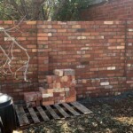 High used brick fence with carefully selected brick placement by Alternative Bricklaying High used brick fence with carefully selected brick placement