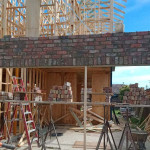 Floating brick over garage entrance by Alternative Bricklaying Floating brick over garage entrance
