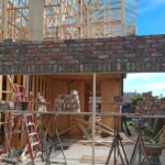 Floating brick over garage entrance by Alternative Bricklaying Floating brick over garage entrance