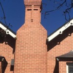 Large red brick tower with cross made from bricks by Alternative Bricklaying Large red brick tower with cross made from bricks