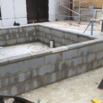 Low large grey brick work by Alternative Bricklaying Low large grey brick work