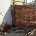 Second hand high red brick fence by Alternative Bricklaying Second hand high red brick fence